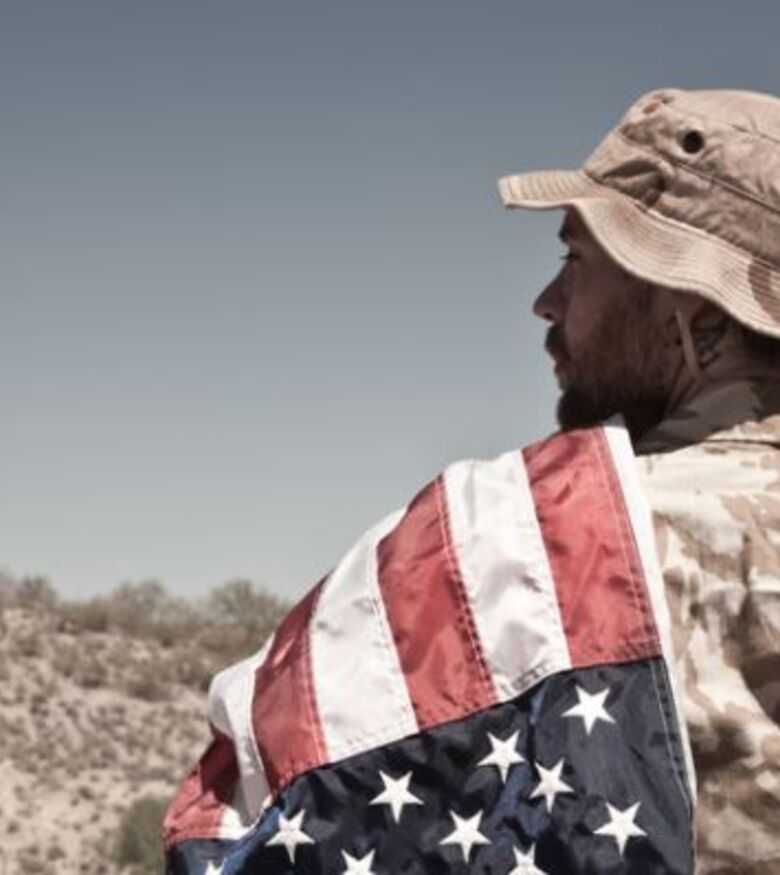 Where Can I Find the Best Veterans Disability Lawyers in St. Louis - veteran holding the american flag
