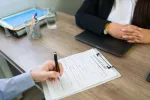 two people reviewing insurance form
