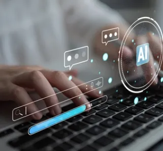 person typing holding a stylus with AI symbols floating across laptop keyboard