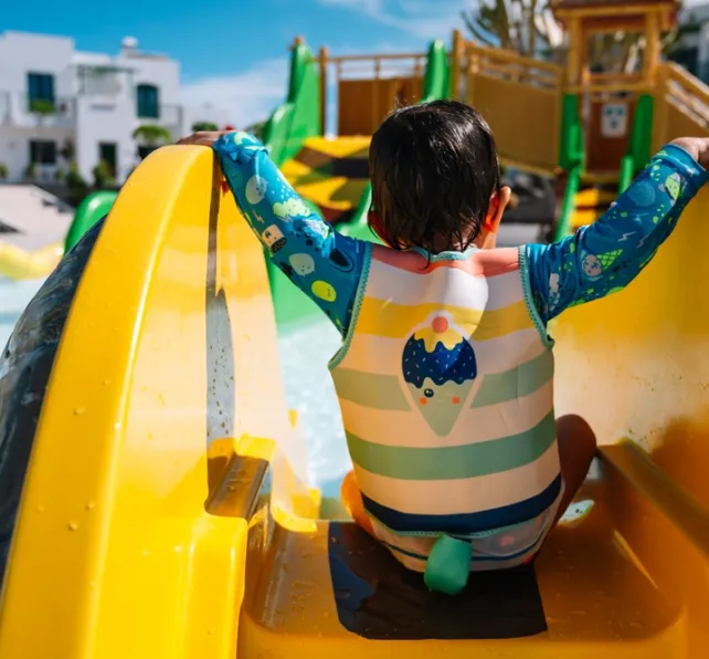What Should I Do After a Water Park Injury in California - kid going down the water slide