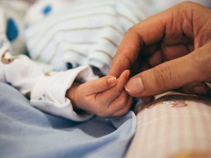 Lexington Birth Injury Attorneys - newborn baby holding mom's hand