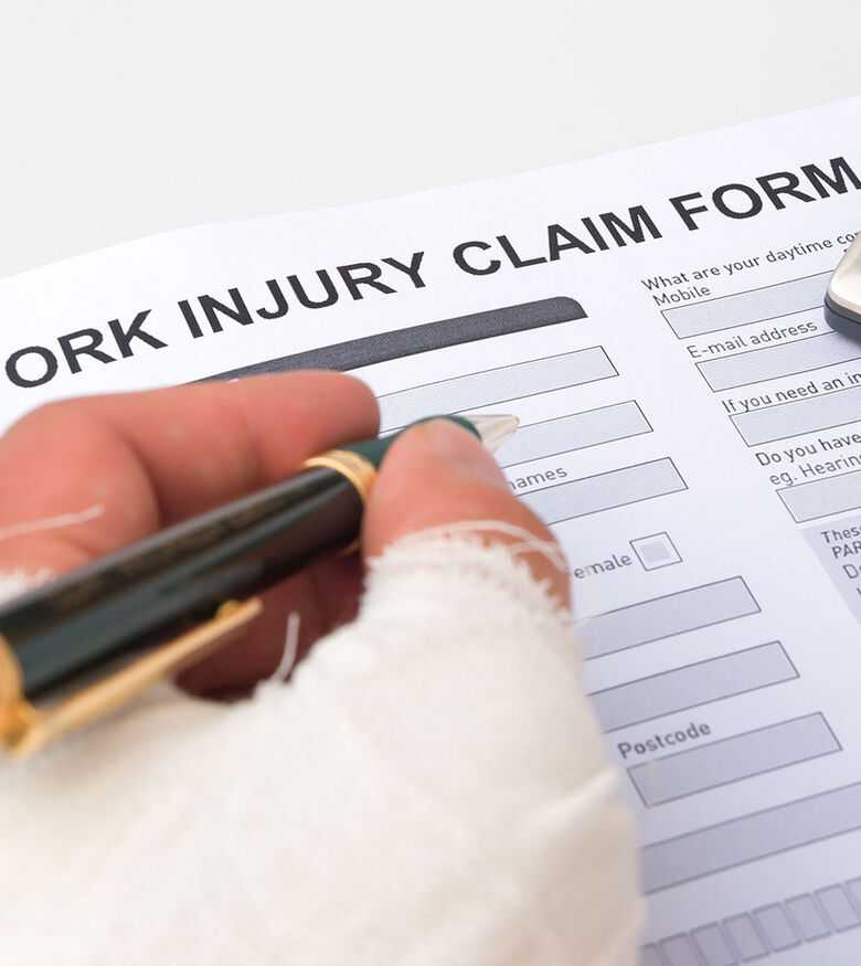 Workers’ Compensation Lawyers in Big Pine Key, FL - Person filling out work injury claim form
