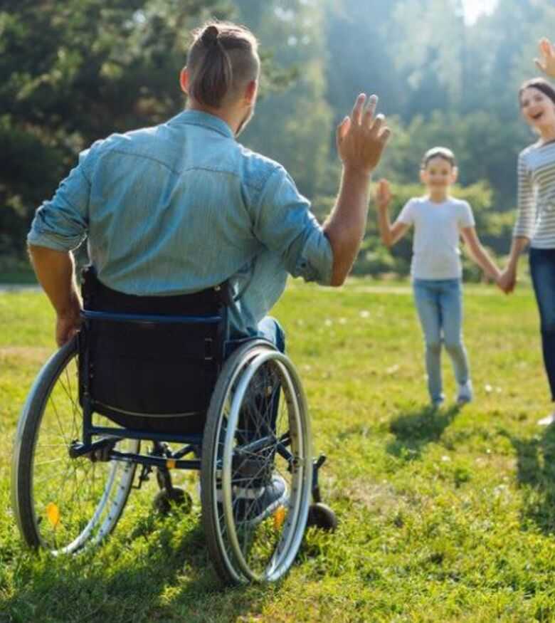 Social Security Disability Lawyers in Pittsburgh, PA - man in wheelchair playing with his family