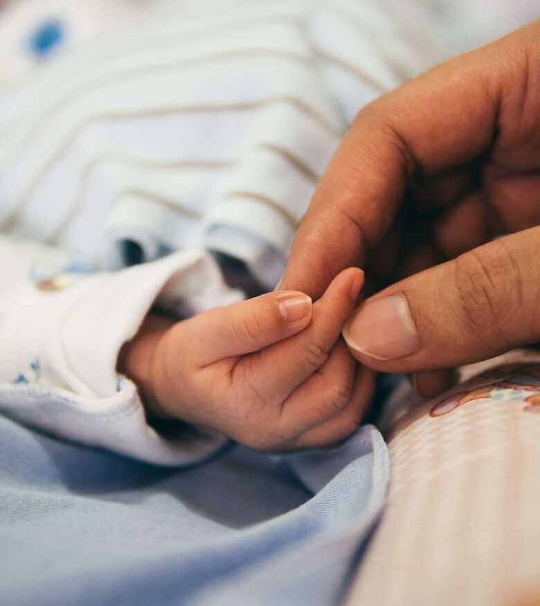 Melbourne Birth Injury Lawyers - newborn baby holding mom's hand