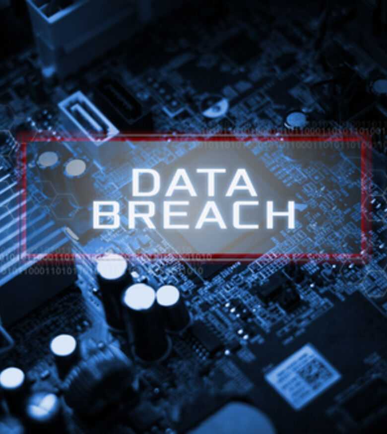Cybersecurity data breach concept with exposed circuitry and warning text overlay