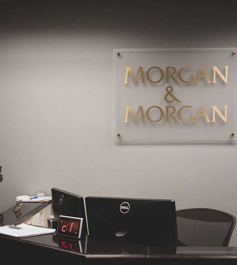 Modern office setup in Memphis with a sleek desk and 'For the People' slogan, suitable for personal injury lawyers.