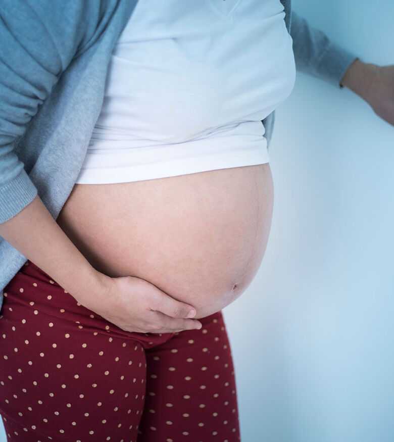 Birmingham Birth Injury Attorneys - Pregnant woman holding stomach