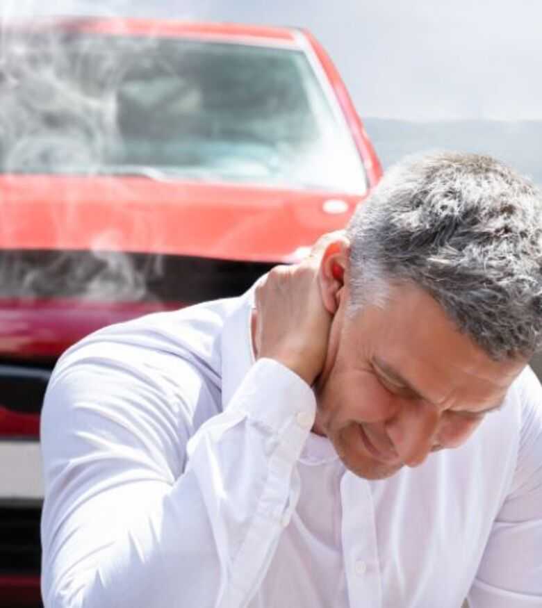 Where Can I Find the Best Car Accident Lawyer in Waltham - male in front of car with damages