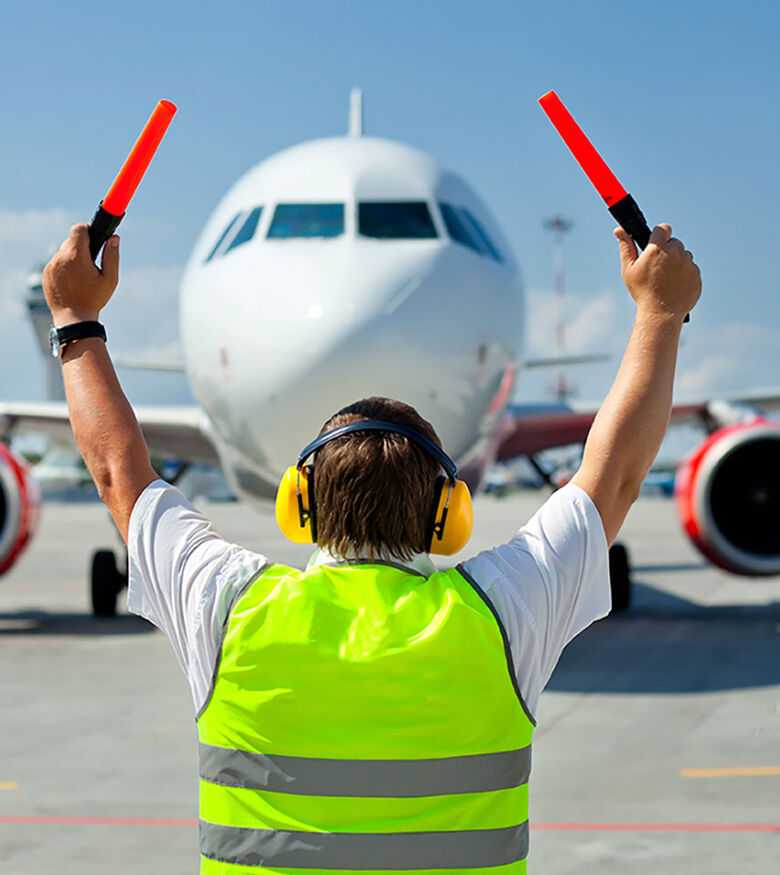 Atlanta Aviation Accident Attorneys- Man directing plane