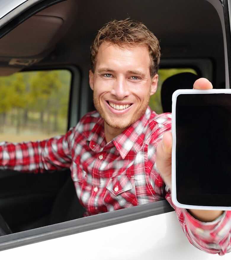 Lyft Accident Attorneys Atlanta - Lyft Driver in car holding phone