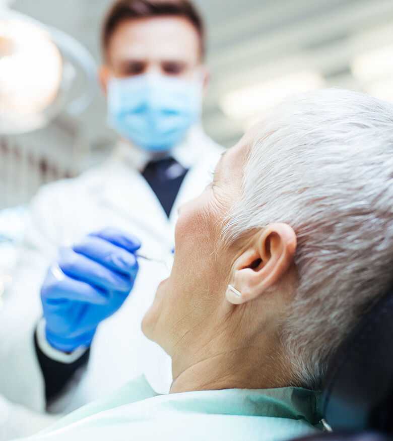 Tampa Dental Malpractice Lawyers - Dentist working on patient