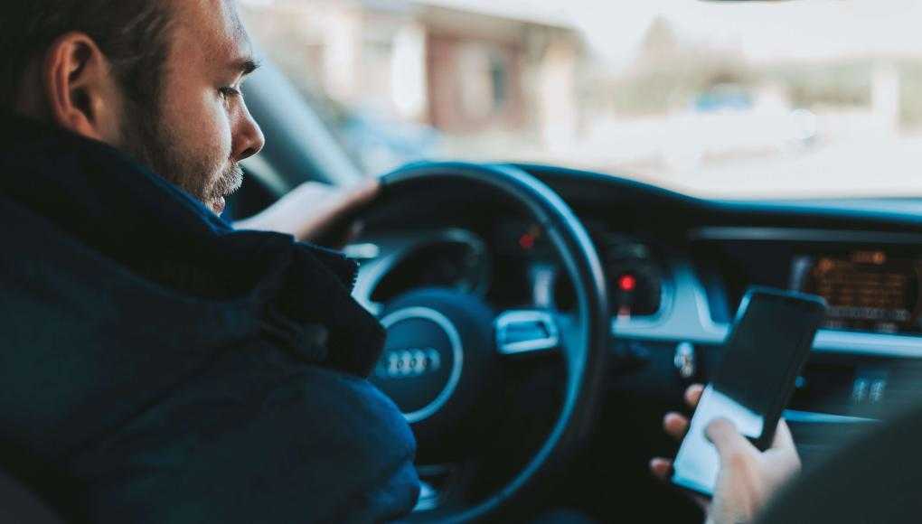 a man texting and driving