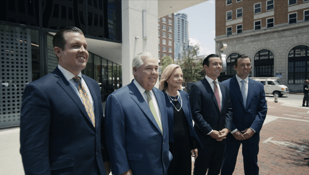 Image of the Morgan Family outside the Morgan & Morgan Orlando office