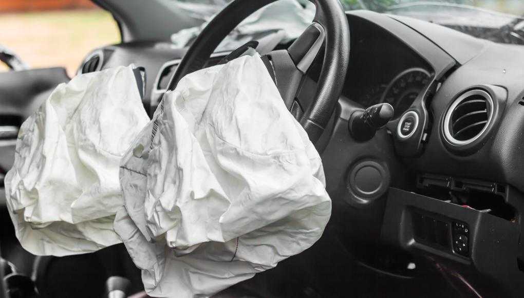 Deployed airbags in a car interior after a crash, illustrating the issue of defective airbags leading to Toyota's recall of over 145,000 vehicles.