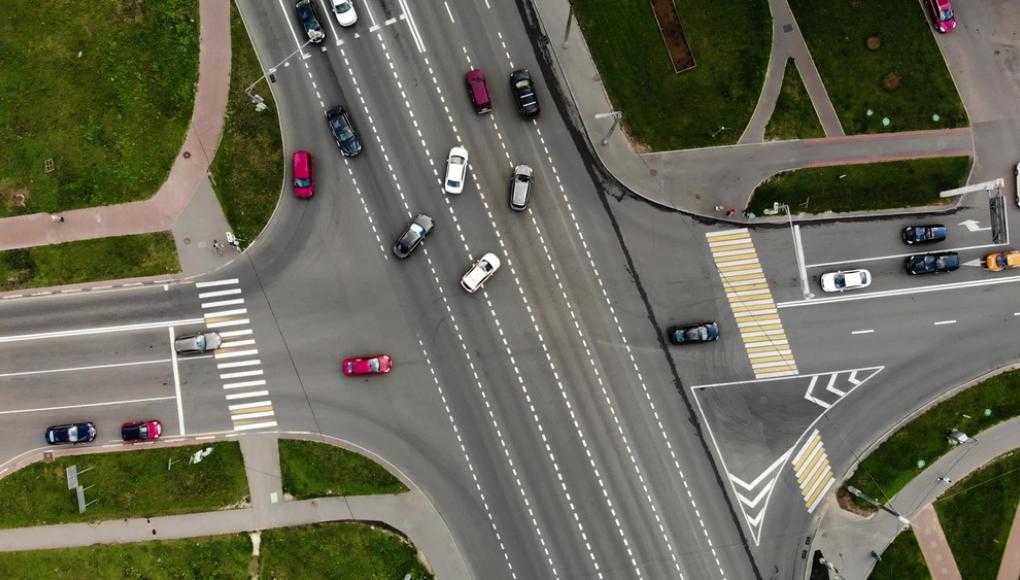 cars in an intersection making left turn