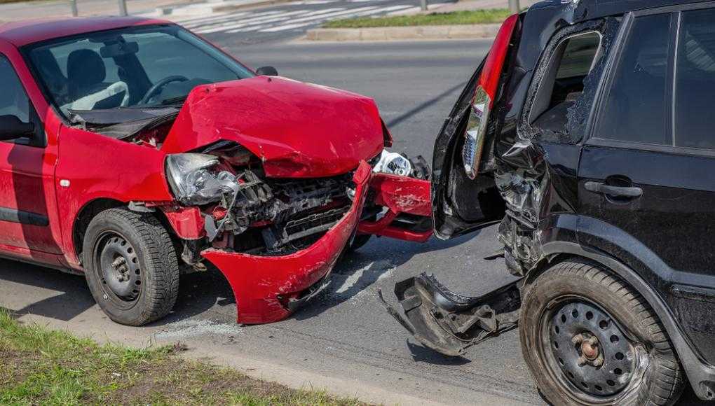 Red car rear ended into a black car