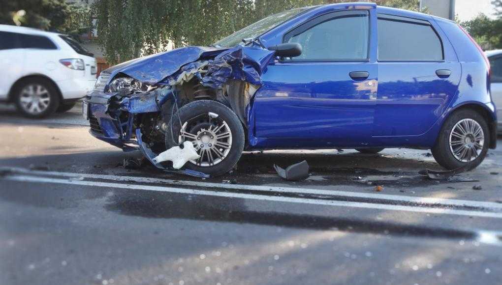 Blue car damaged after an accident