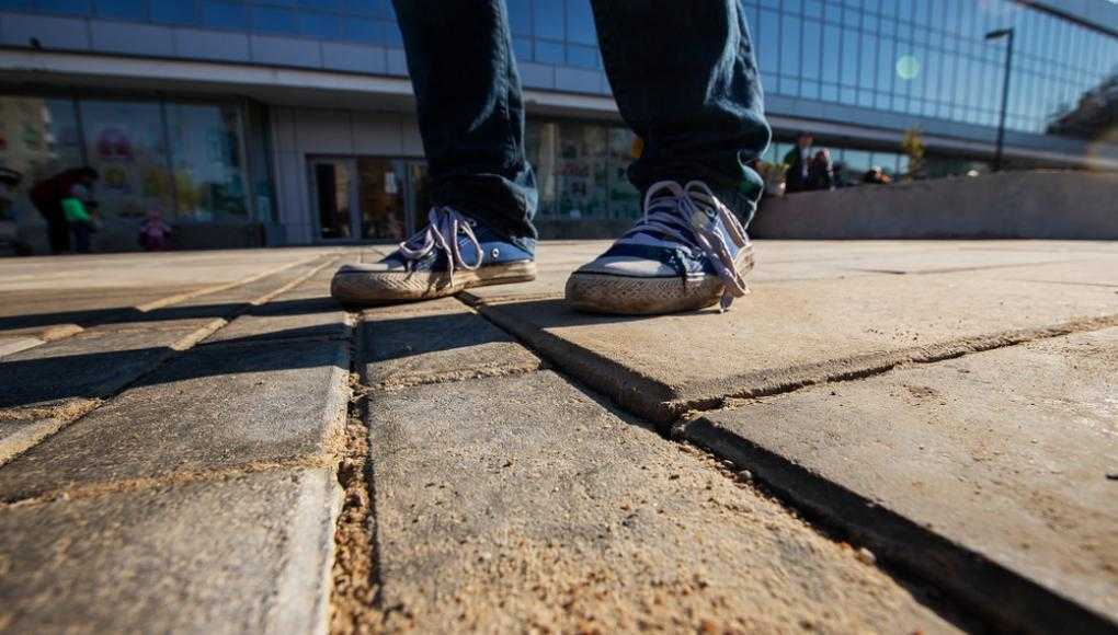 Someone walking on an uneven sidewalk