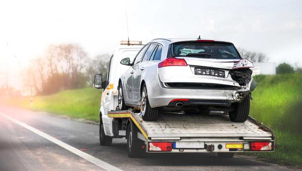 Damaged car being towed