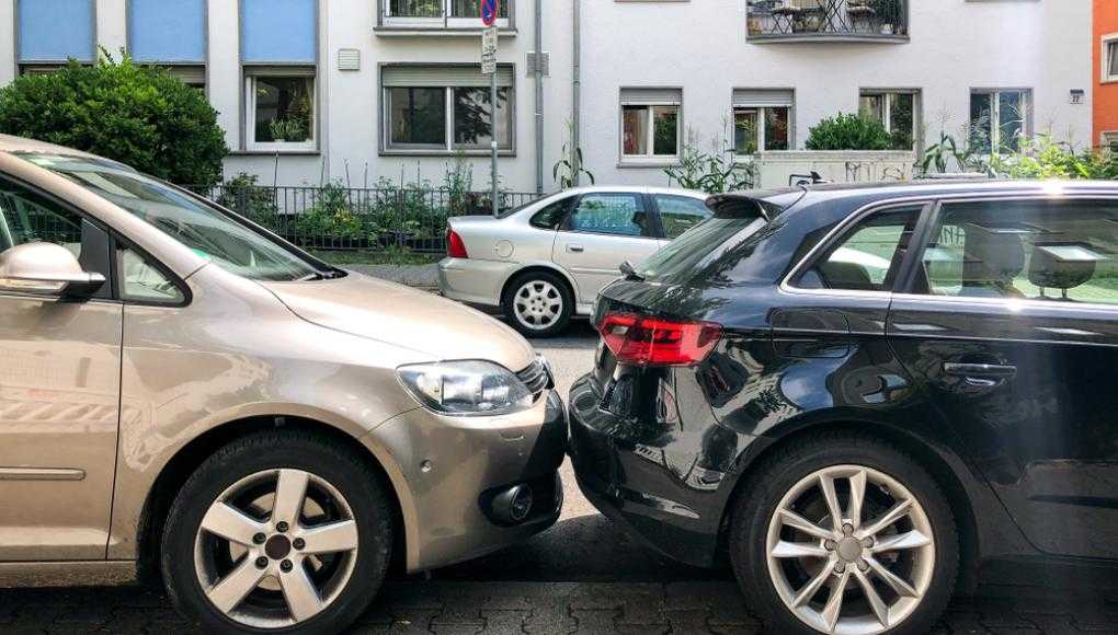 Cars parked very close to each other