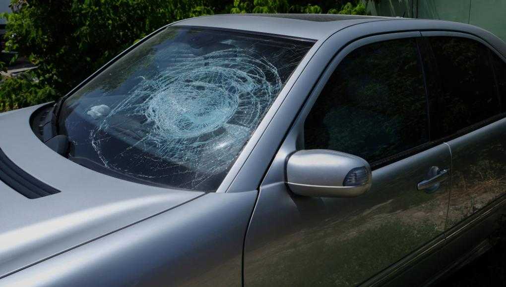 Grey car with a shattered front window