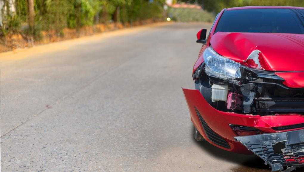 Red car damaged after an accident