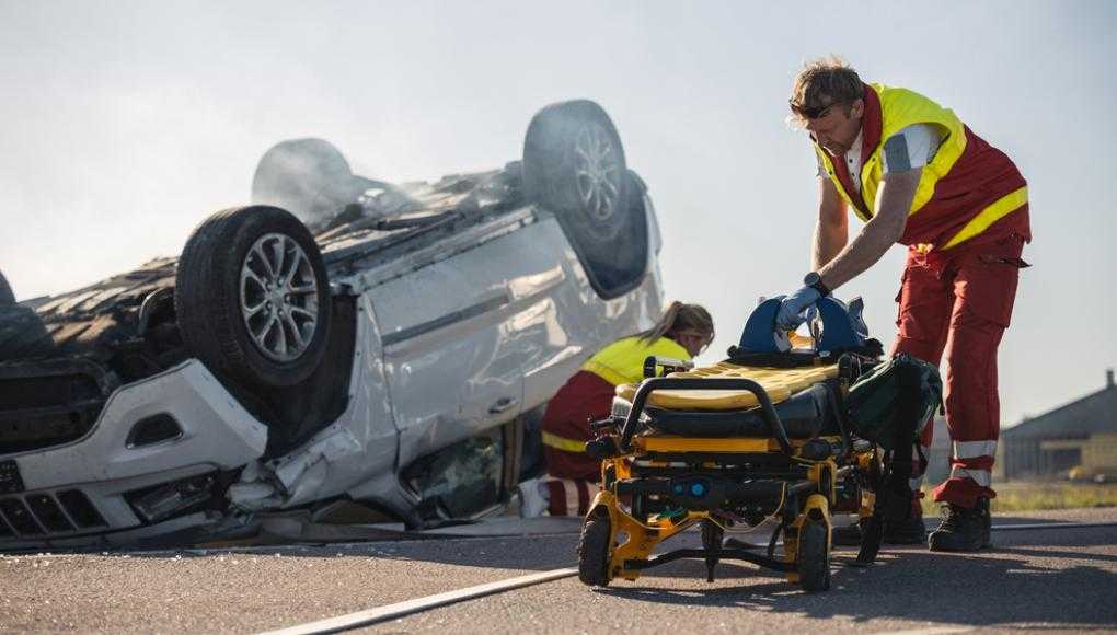 Paramedics arriving on the scene of a car crash