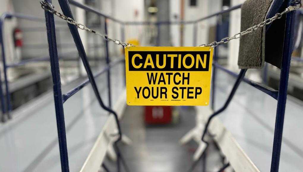 Caution watch your step sign