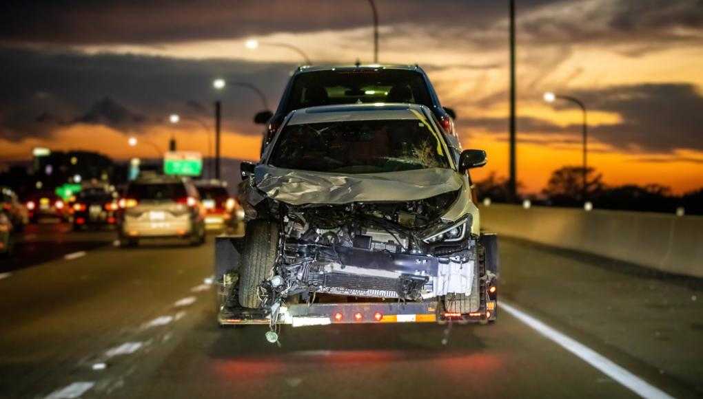 Damaged car being towed