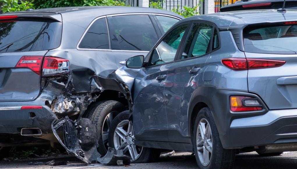 Two grey SUVs crashed into each other