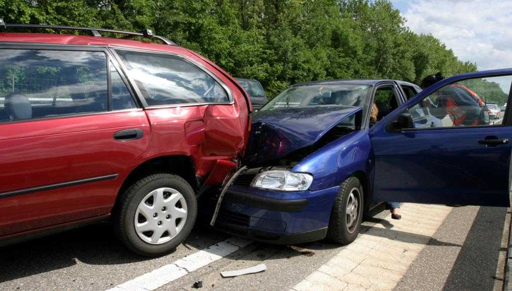 Blue car crashed into a red van