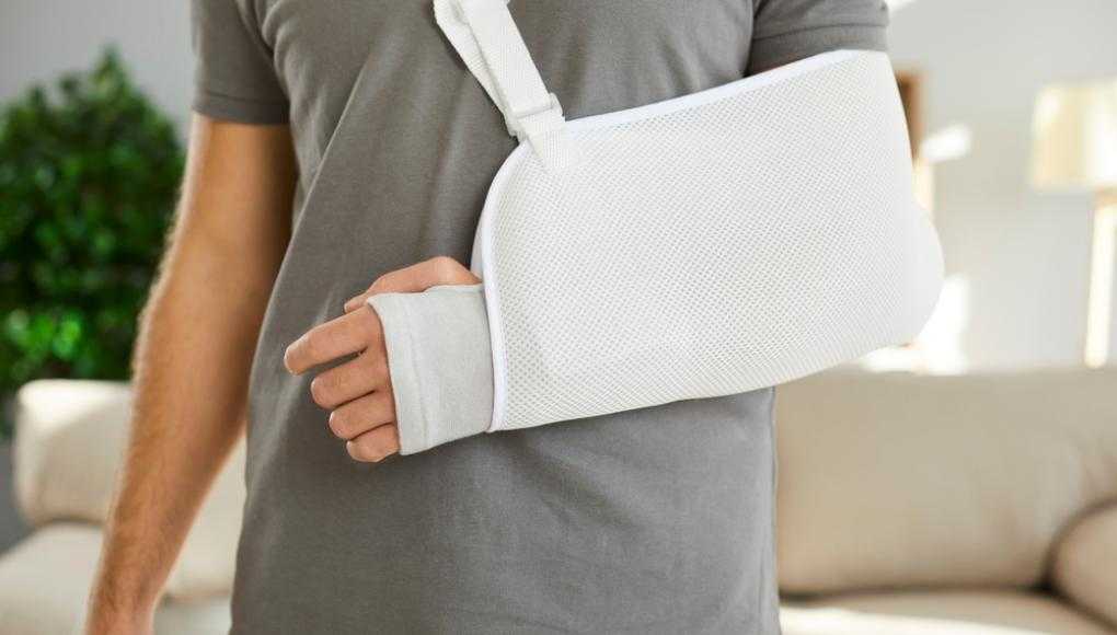 Man with an injured arm in a sling