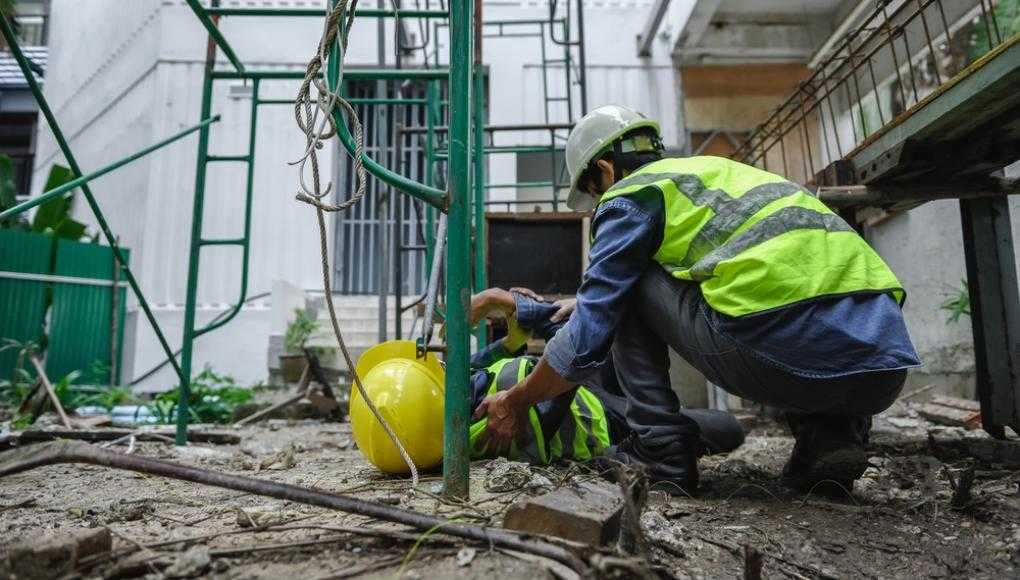 Injured construction worker on the ground