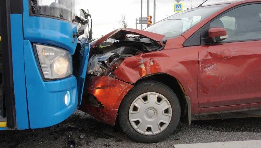 Red car crashed into blue bus