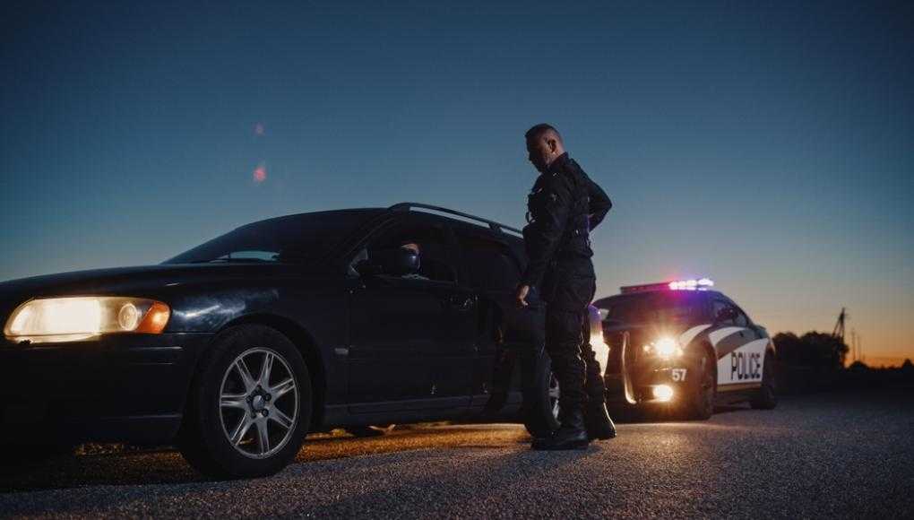 Policeman talking to a car that was pulled over