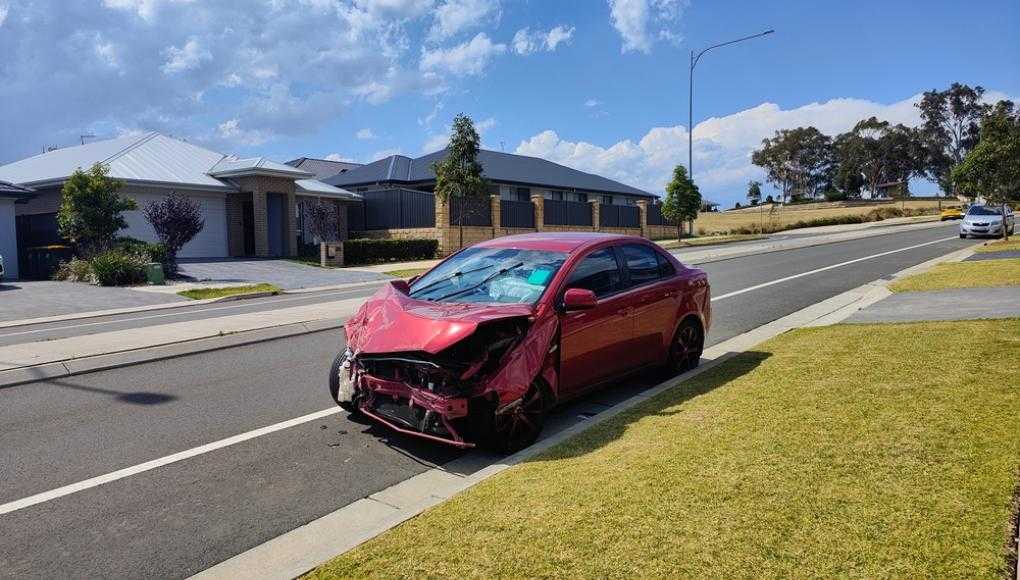 Damaged red car after an accident