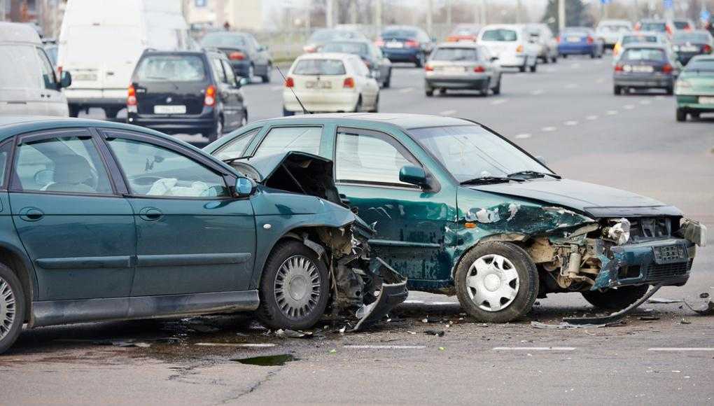 Two green cars crashed into each other