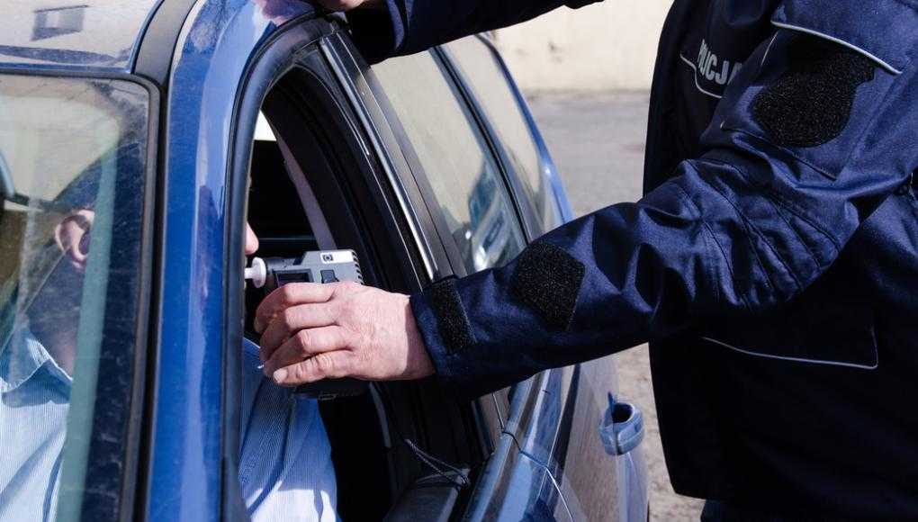 Police officer using a breathylizer