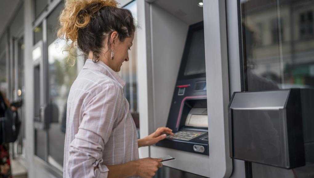 Women using an ATM