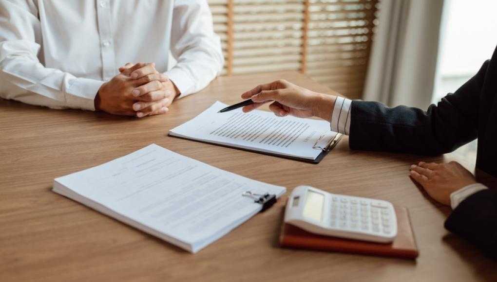 Lawyer and client discussing paperwork