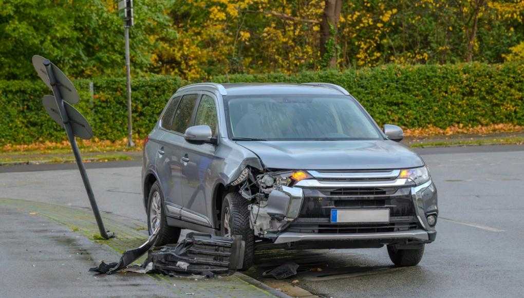 Damaged car in a parking lot