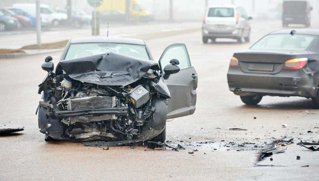 Damaged car on a busy road