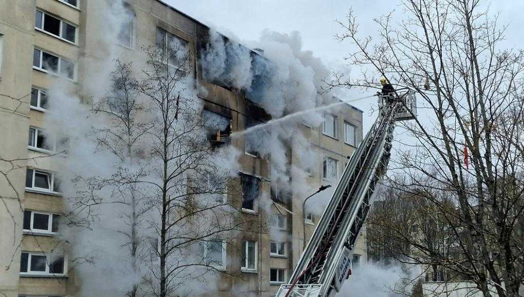 Firemen putting out an apartment fire