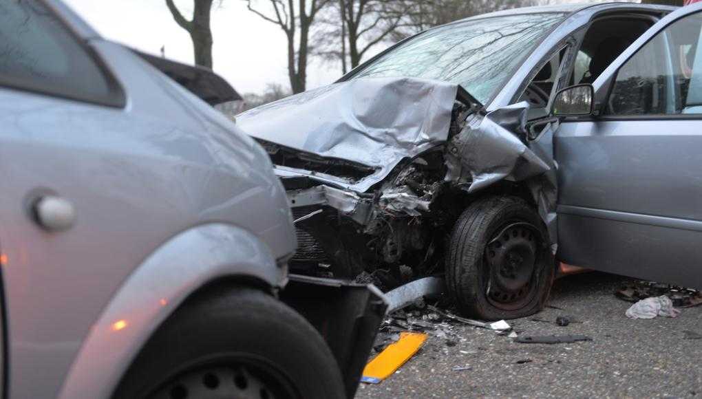 Two grey cars crashed into each other on a road