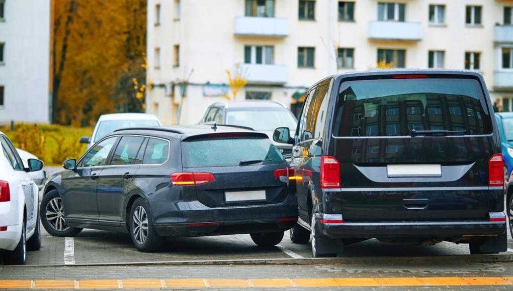 Car parked sideways in a lot