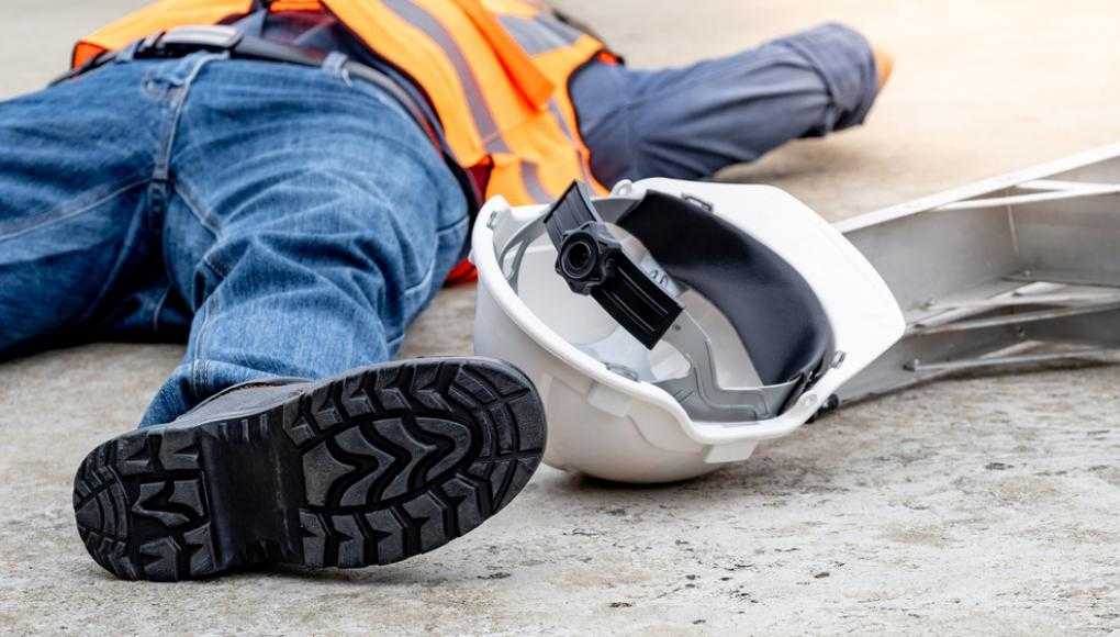 Construction worker laying on the floor