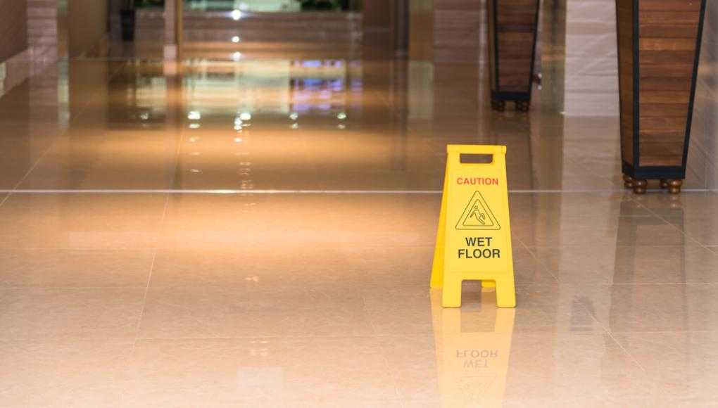 Caution wet floor sign in a hallway