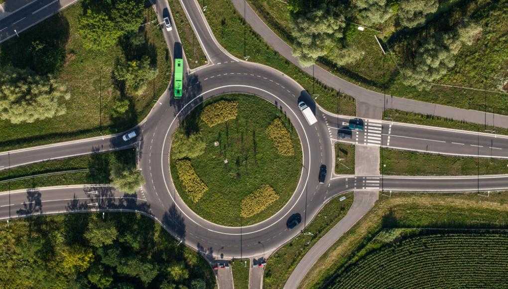 Aerial view of cars driving around a roundabout