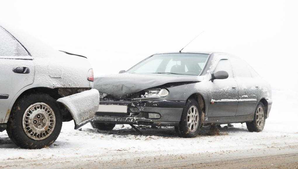 Two cars after an accident in the snow