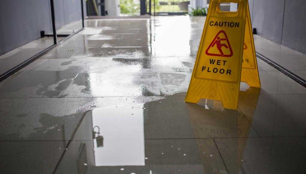 Caution wet floor sign on a wet floor